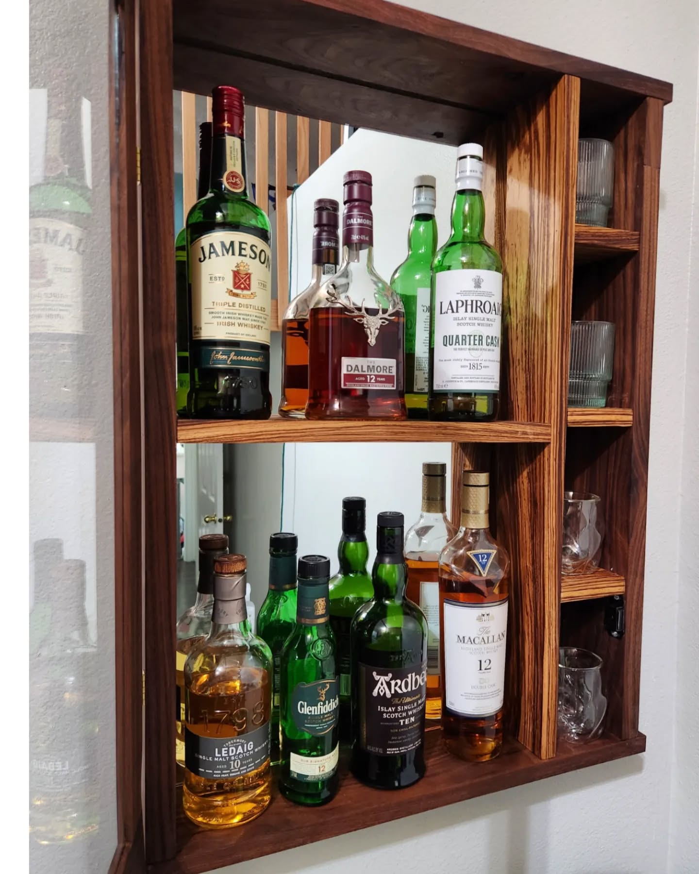 Do y'all have any idea how hard it is to take pictures that involve a mirror or glass doors!?! I'm trying to be a modern day Houdini so I wouldn't be seen! 
However, I love this new whisky cabinet I made for myself. Made from Black Walnut and Zebrawood. This thing is a beast in the weight department, but the wood pairs well, and the mirrored back and glass door really cap off the elegant look I was going for. 
If anyone is interested in their own, please reach out 😊
Wood credit: @hudsonandwestmeridian 
Finish: @rubiomonocoatusa 
#customwoodworking #custom #woodworking #woodpreneur #whisky #drinkresponsibly #veteranowned #smallbusiness #buyidaho #shoplocal #boise #idaho