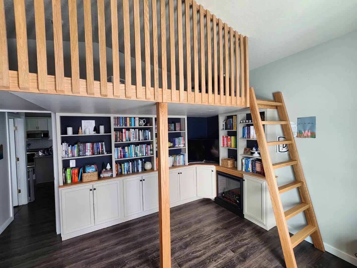 News renovation complete! Or nearly complete.. There are still a few minor things to wrap up, but I wanted to share!! 
Just finished this loft/library built in combo! This room when we purchased the house was your traditional empty 4 blank walls bonus room. With the vaulted ceiling my wife and I always wanted to do something with this space, it acted as a room for our dogs, a office/work out space for a while, and ultimately because a catch all for box's and just stuff..
After we had our son we (my wife) decided she wanted a loft and reading space, the loft for a space for our son to play, and a library to showcase her book collection capped off with a fireplace to read next too.
I couldn't be happier with how it all turned out!! We started the project in January, and I slowly worked on it within our budget doing small things here and there. Now that it's finally complete, I think I might start our master bathroom next... we shall see! 
Wood credit: @hudsonandwestmeridian 
Wood finish: @rubiomonocoatusa 
#custom #renovation #diy #woodworking #woodpreneur #craftsmanship #library #loft #veteranowned #smallbusiness #builtins #custombuilt